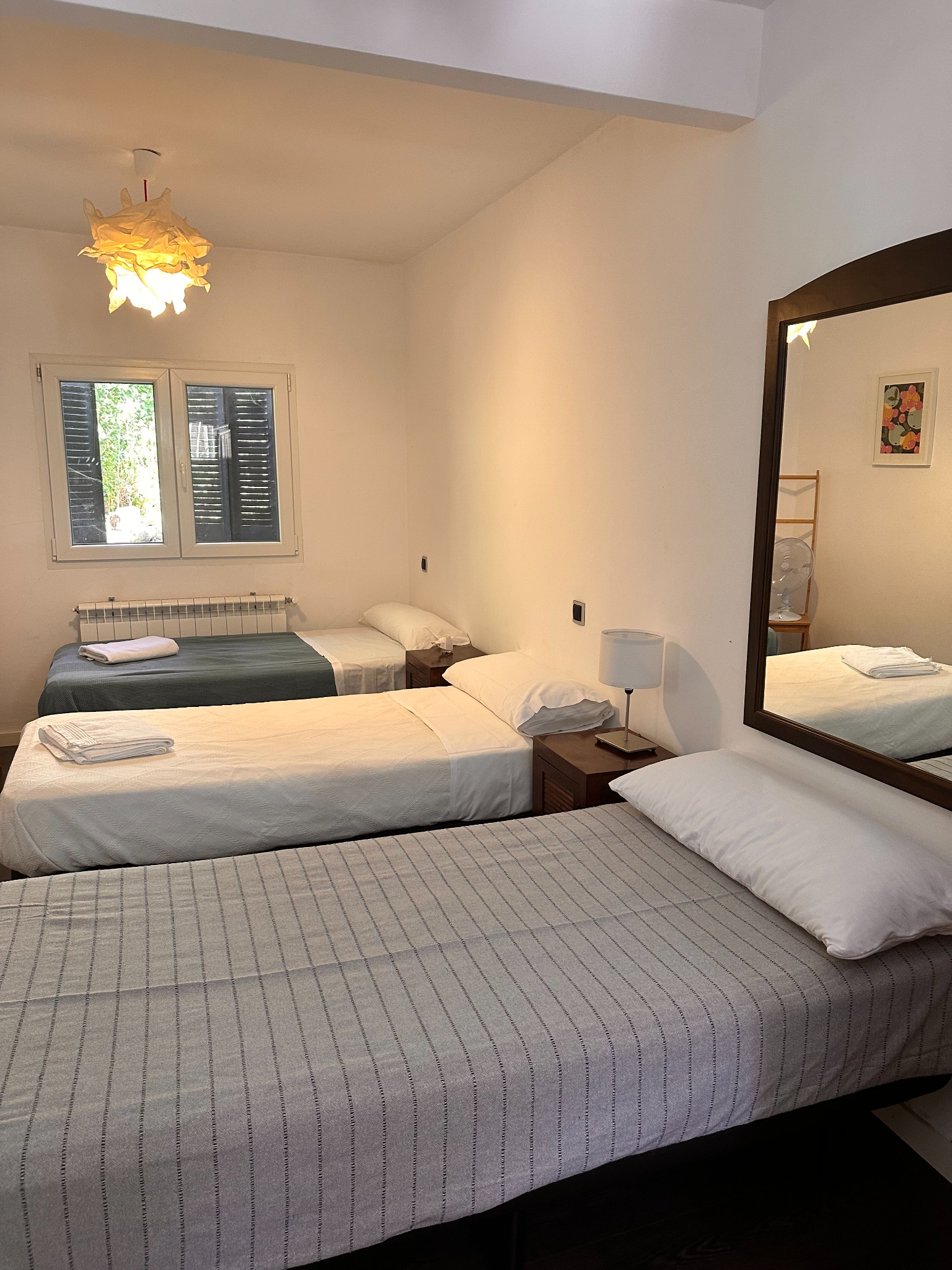Dormitorio con tres camas del Apartamento 2